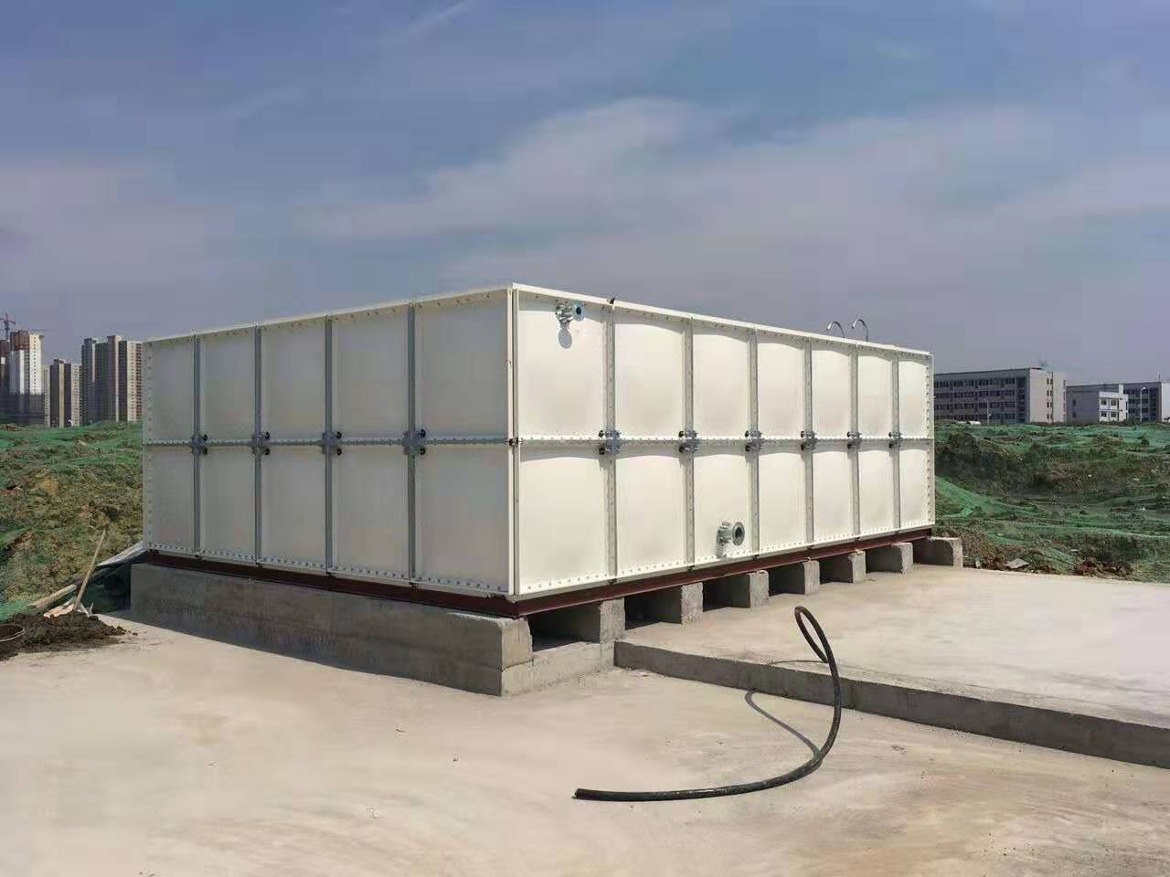 Fiberglass water tank and galvanized steel tower